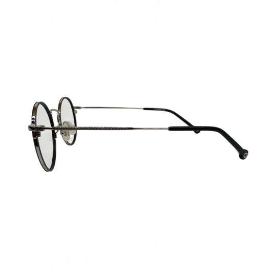 T20 Opticals Vintro Club GDM040 round eyeglasses with a sleek stainless steel frame and thin temples, side view.